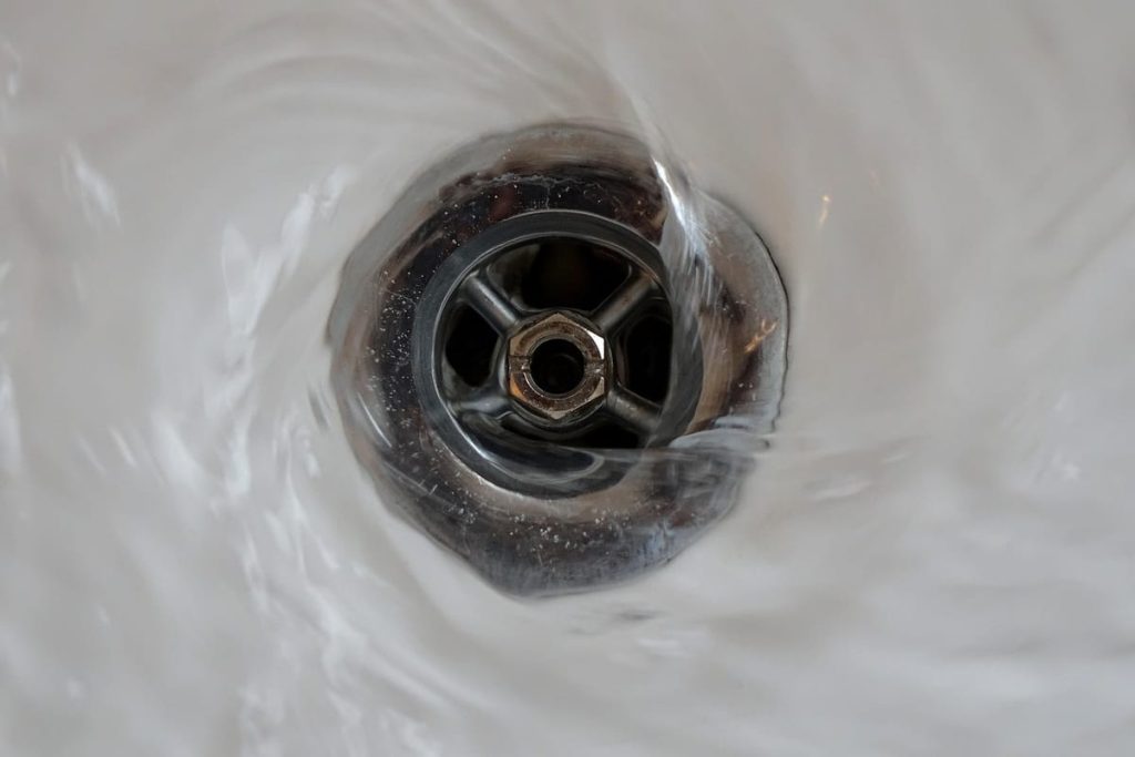 Water swirling down a sink drain