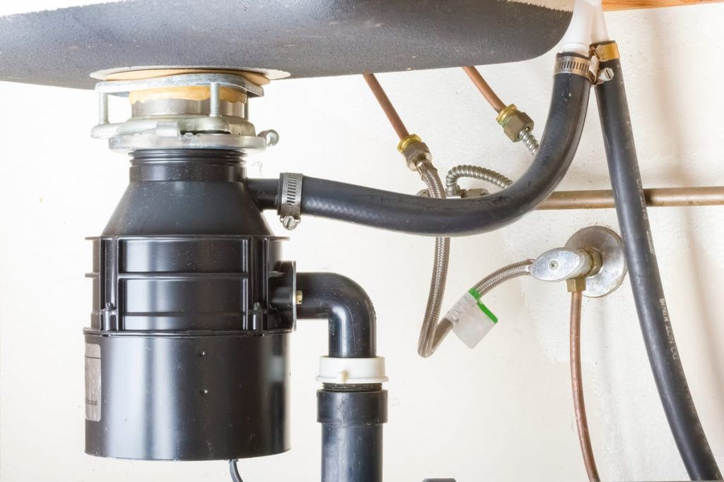 Garbage disposal unit connected under a sink