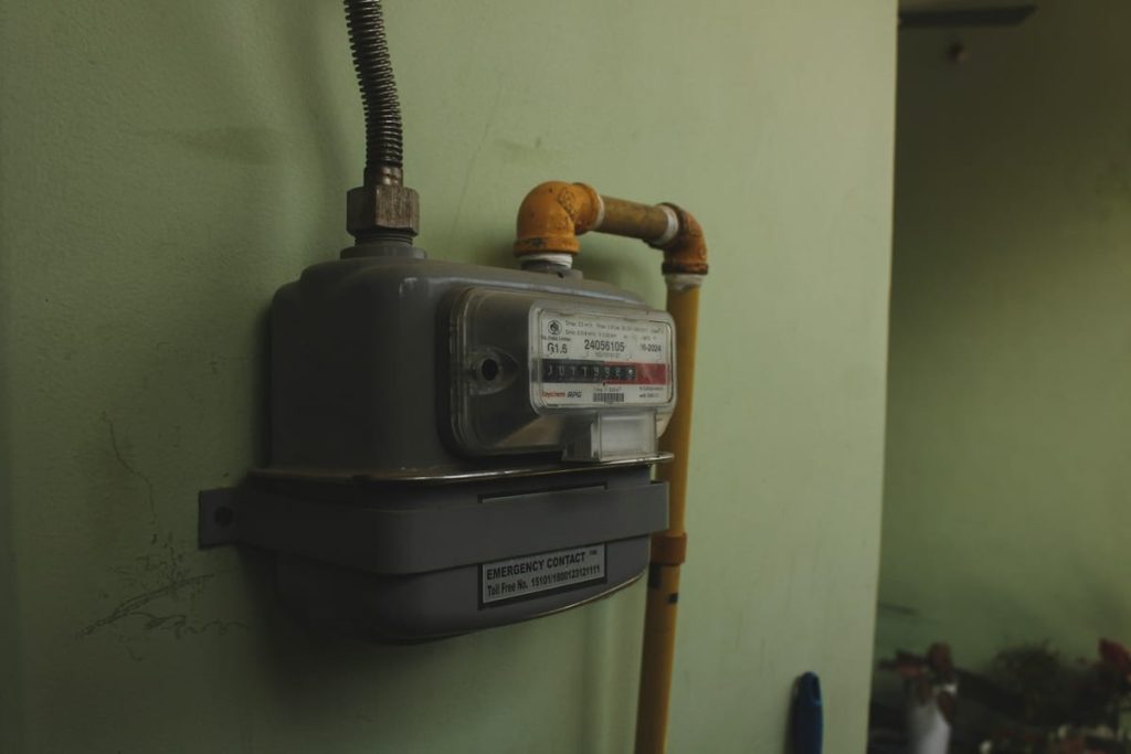 Gas meter with supply pipe mounted on a wall