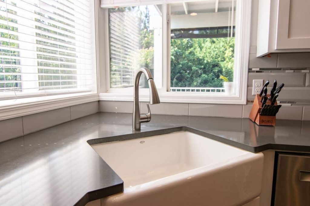 Farmhouse kitchen sink by a bright window
